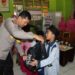 Polres Sukabumi Kota Salurkan Bantuan Peralatan Sekolah Bagi Puluhan Siswa Yatim Sekolah Dasar