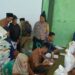 Bhabinkamtibmas Desa Langensari Aipda Fajar BP monitoring pelaksanaan pembagian Bansos beras kepada warganya