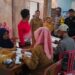 Bhabinkamtibmas Polsek Cisaat  Bersama Babinsa Kawal Penyaluran BLT Dana Desa