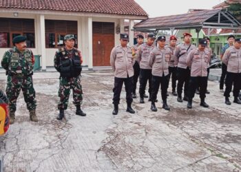 Apel Serah Terima Piket Pengamanan di Sekretariat GOR UNLIP Gudang Logistik Pemilu PPK Citamiang Kota Sukabumi